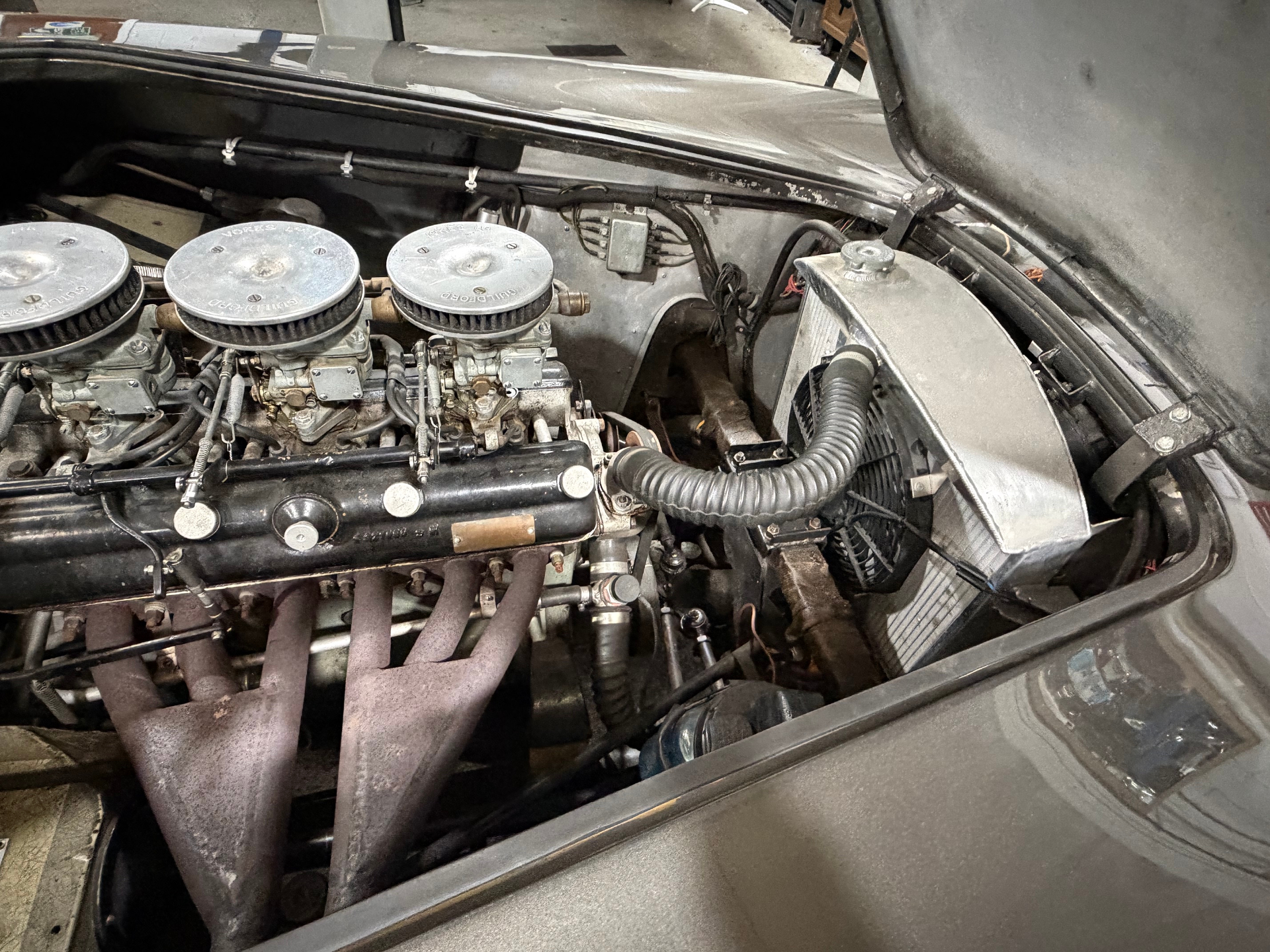 Aceca-Bristol engine bay showing the two-litre six with triple carburettors on Guildford air filters and tubular exhaust manifold