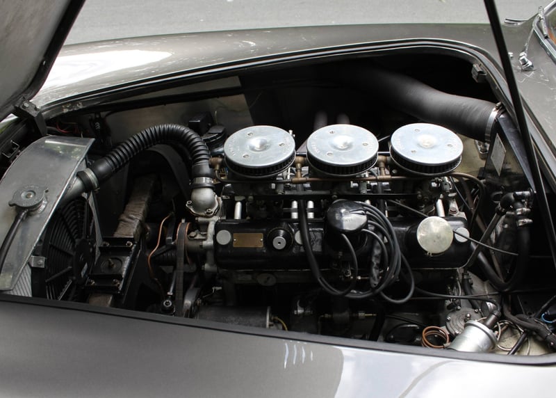Detailed view of an Aceca-Bristol engine bay with the two-litre six, triple carburettors and air-filter domes visible