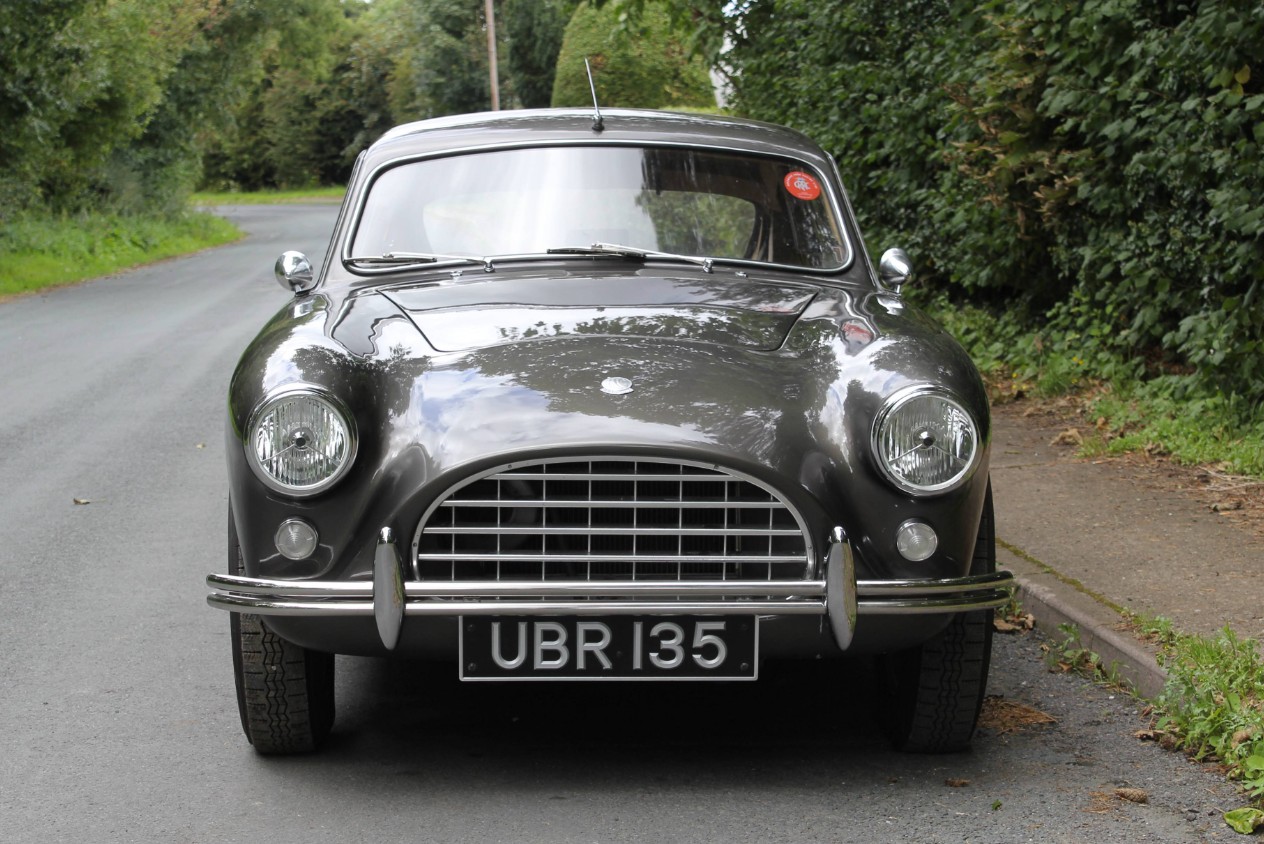 Head-on view of UBR 135 showing the AC Aceca's slender egg-crate grille, faired headlamps and chrome twin-tube bumper