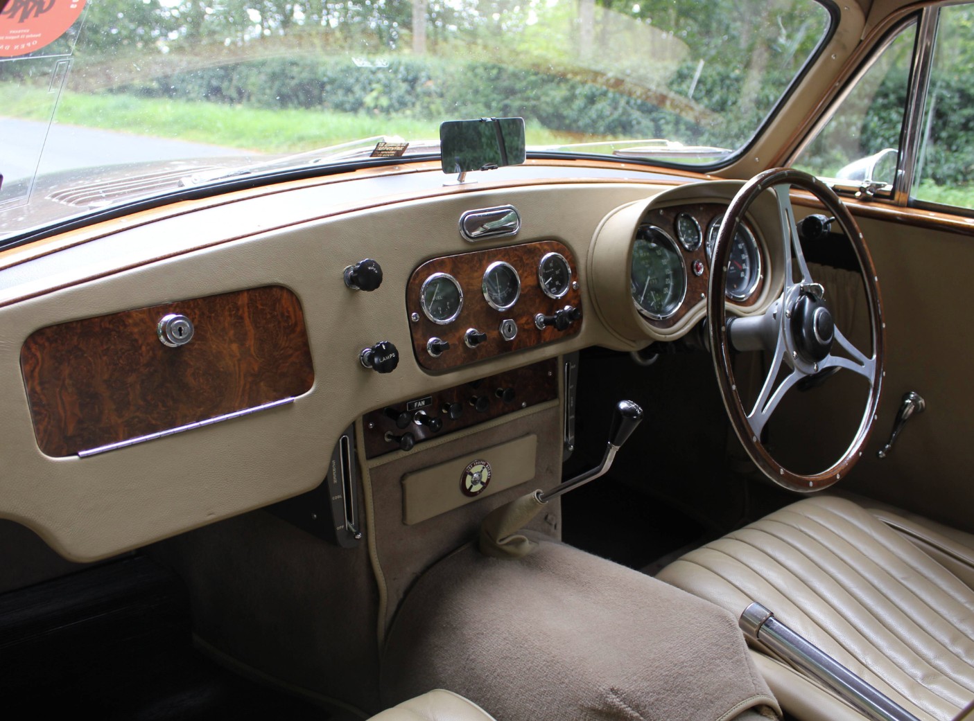 Dashboard of UBR 135 showing the burr walnut instrument panel, Smiths gauges and original toggle switchgear