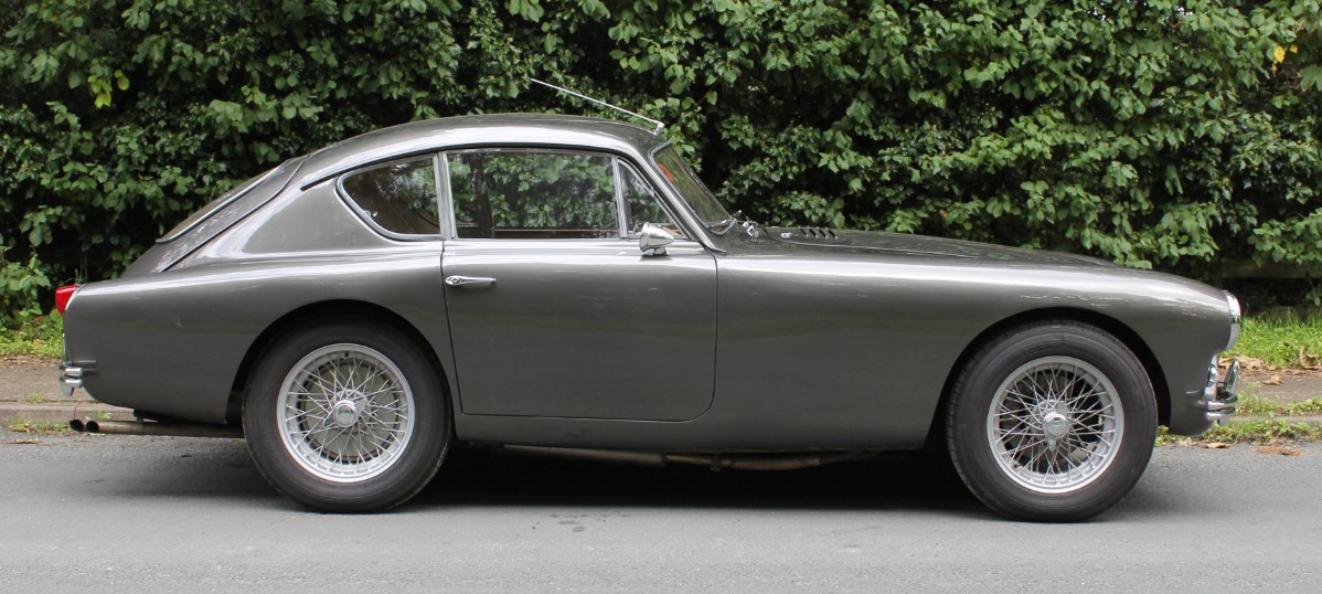 Side profile of 1958 AC Aceca-Bristol UBR 135, showing the continuous fastback roofline, opening tailgate and centre-lock wire wheels
