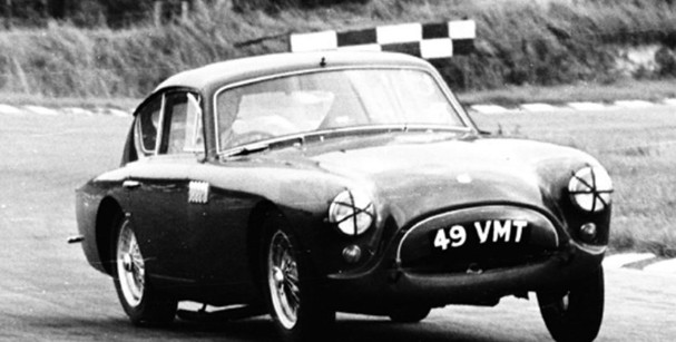 An AC Aceca-Bristol racing car, number 49 VMT, on the Le Mans grid in the late 1950s