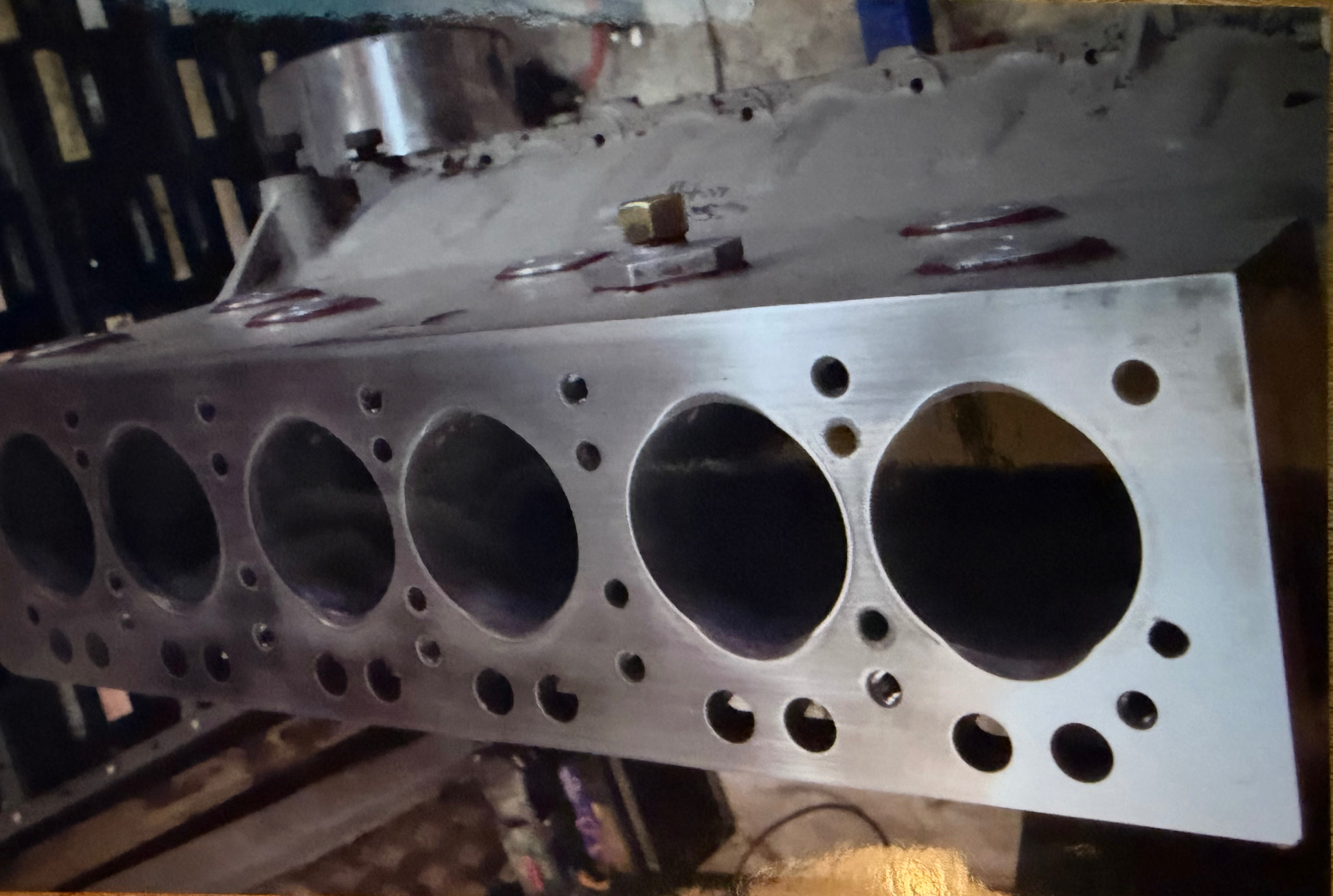 Machined deck face of a Bristol six-cylinder engine block, with all six cylinder bores clean and visible after reboring