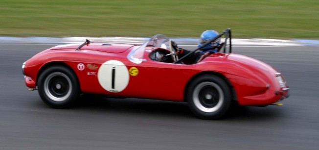 The red Tojeiro-Bristol barchetta registered LOY 500 on a race circuit, the Ferrari-inspired prototype that shaped the AC Ace and Aceca