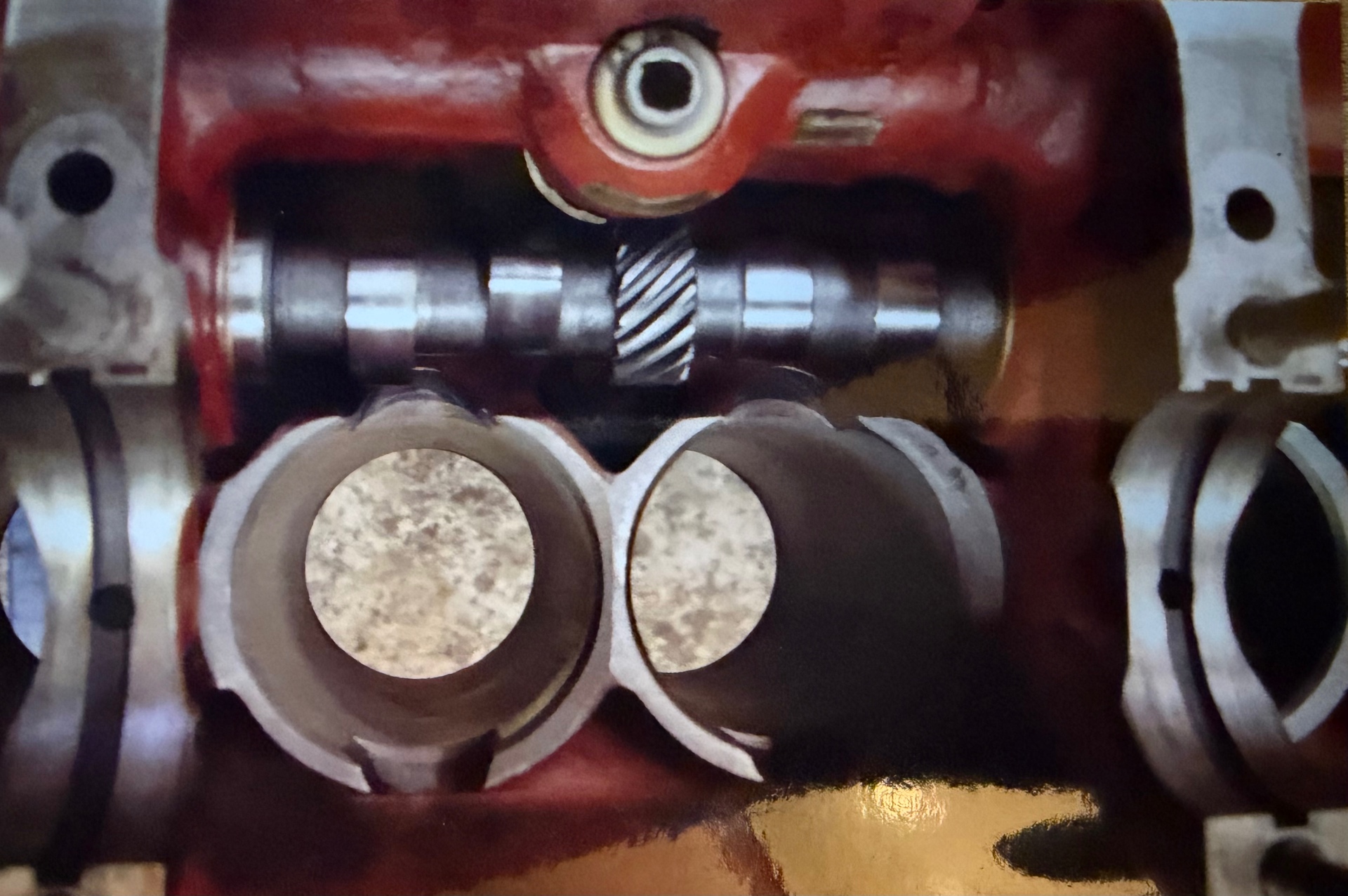 Camshaft and helical drive gear fitted low in the Bristol six crankcase, visible between the cylinder bores