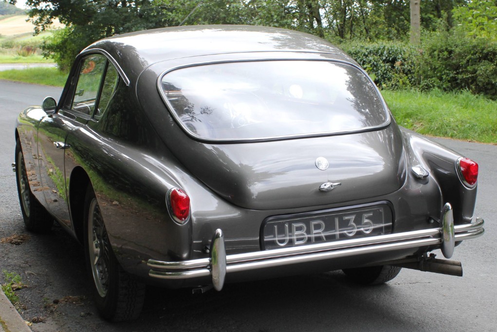 Rear three-quarter view of UBR 135, showing the wraparound rear screen, AC roundel and twin-tube bumper with pear-shaped overriders
