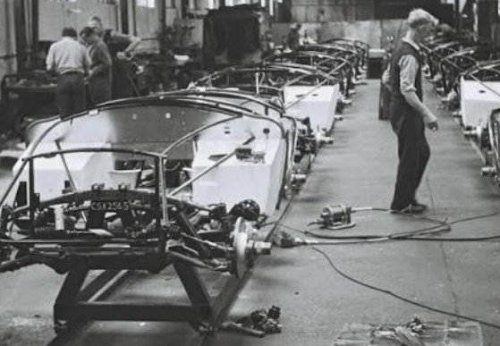 AC Aceca chassis on the production line at Thames Ditton, 1963, with workers assembling the hand-built cars